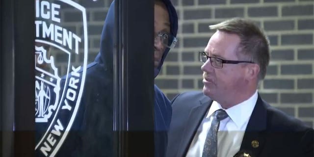 Lashawn Mackey is led out of the police precinct following his arrest for Maria Hernandez's murder. He was indicted in New York Supreme Court on Tuesday.