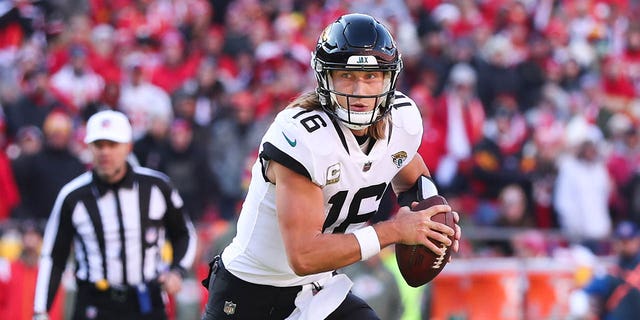 Jacksonville Jaguars quarterback Trevor Lawrence looks for a pass in the third quarter of a game against the Kansas City Chiefs on November 13, 2022 at GEHA Field at Arrowhead Stadium in Kansas City, Missouri.