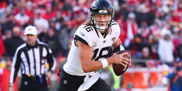 Jacksonville Jaguars quarterback Trevor Lawrence looks for a pass in the third quarter of a game against the Kansas City Chiefs on November 13, 2022 at GEHA Field at Arrowhead Stadium in Kansas City, Missouri.