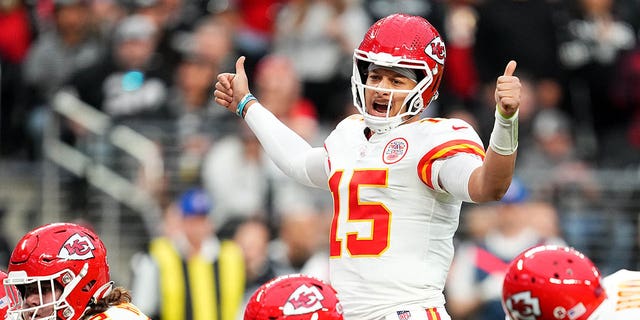 Patrick Mahomes (15) of the Kansas City Chiefs points at the line of scrimmage against the Las Vegas Raiders during the first half of a game at Allegiant Stadium on January 7, 2023 in Las Vegas. 