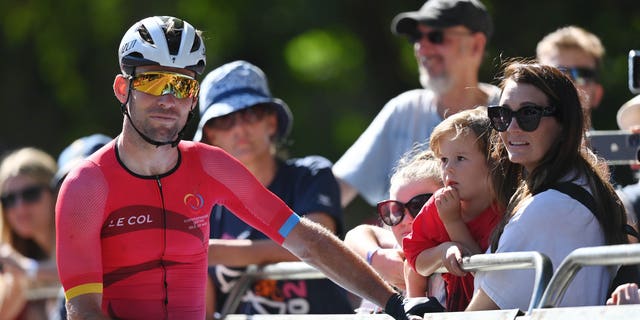Mark Cavendish of Team Isle of Man interacts with his wife, Peta Todd and hild after the Men's Road Race on day ten of the Birmingham 2022 Commonwealth Games on August 7, 2022 in Warwick, England.