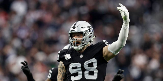 Maxx Crosby, #98 of the Las Vegas Raiders, reacts during an NFL football game between the Las Vegas Raiders and the New England Patriots at Allegiant Stadium on December 18, 2022, in Las Vegas, Nevada.