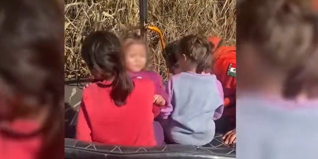 Still image from a video released by the Mexican National Institute of Migration showing the rescue of three sisters abandoned at the border.