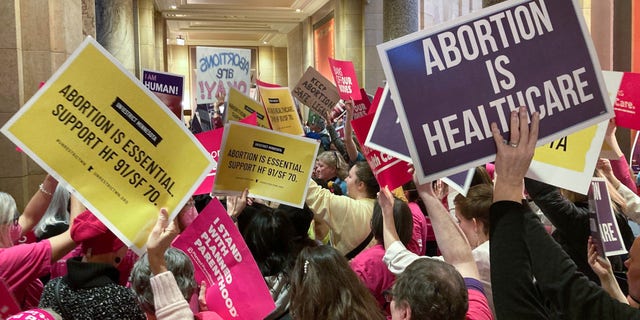 Abortion protesters on both sides fill the halls outside the Minnesota Senate chamber at the State Capitol in St. Paul, Minnesota on Friday, January 27, 2023.