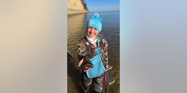 Molly Sampson, a 9-year-old from Prince Frederick, Maryland, found a 5-inch-long megalodon tooth in the water during a fossil-hunting trip with her sister and father on Christmas Day.
