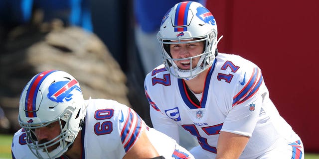 Josh Allen (17) and Mitch Morse (60) of the Buffalo Bills warm up before a game against the Los Angeles Rams Sept. 27, 2020, in Orchard Park, N.Y.