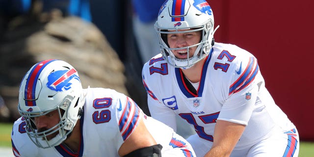 Josh Allen (17) and Mitch Morse (60) of the Buffalo Bills warm up before a game against the Los Angeles Rams Sept. 27, 2020, in Orchard Park, N.Y.