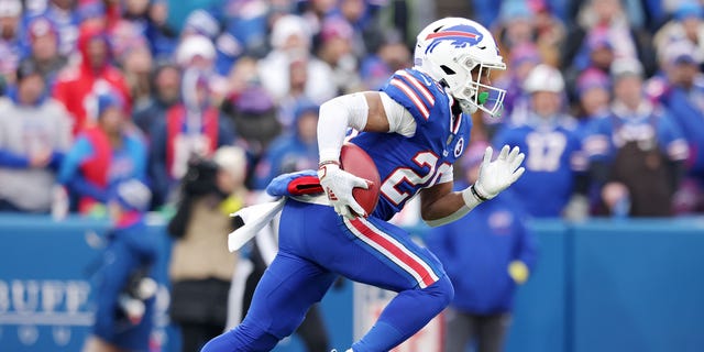 Buffalo Bills' Nyheim Hines returns the kickoff for a touchdown during the first quarter against the New England Patriots at Highmark Stadium in Orchard Park, New York on Sunday.