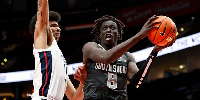 Omaha Biliew #8 of World Team shoots against Kel'el Ware #11 of USA Team in the third quarter during the Nike Hoop Summit at Moda Center on April 08, 2022 in Portland, Oregon.