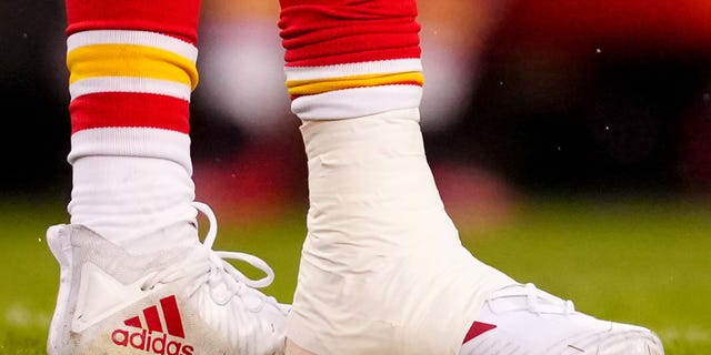 The taped right ankle of Patrick Mahomes of the Chiefs during the playoff game against the Jacksonville Jaguars at Arrowhead Stadium on Jan. 21, 2023, in Kansas City, Missouri.