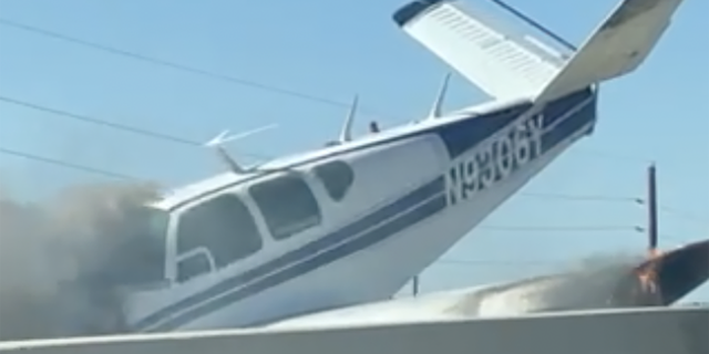 Video taken by a passing motorist showed smoke billowing out of the plane's cockpit.