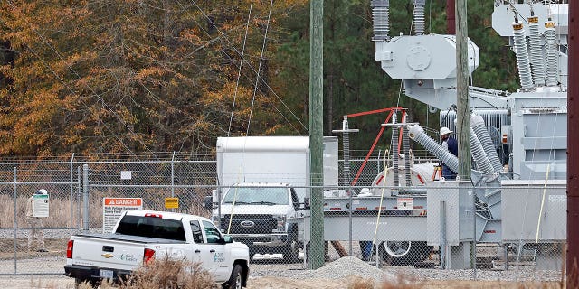 Employees work on equipment at the West End Substation in North Carolina, on Dec. 5, 2022, where a serious attack on critical infrastructure caused many residents to lose power.