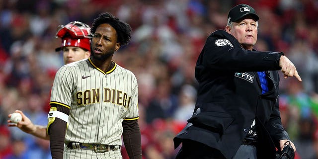 Jurickson Profar # 10 of the San Diego Padres is ejected by home plate umpire Ted Barrett after arguing a called swing call during the ninth inning in game three of the National League Championship Series at Citizens Bank Park on June 21 October 2022 in Philadelphia, Pennsylvania.