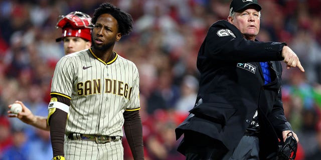Jurickson Profar #10 of the San Diego Padres is ejected by home plate umpire Ted Barrett after arguing a checked swing call during the ninth inning in game three of the National League Championship Series at Citizens Bank Park on October 21, 2022 in Philadelphia, Pennsylvania.