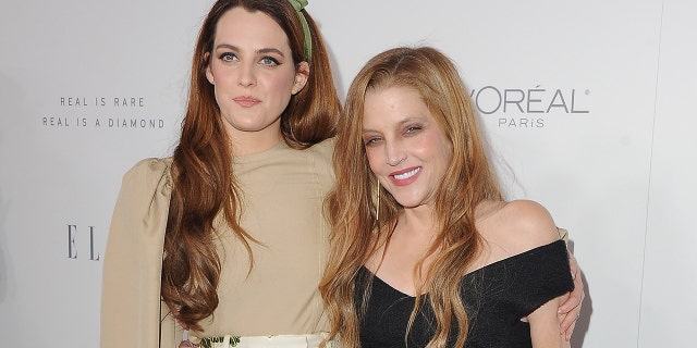 Riley Keough and Lisa Marie Presley arrive at Elle's 24th Annual Women in Hollywood Celebration on Oct. 16, 2017, in Los Angeles, California.