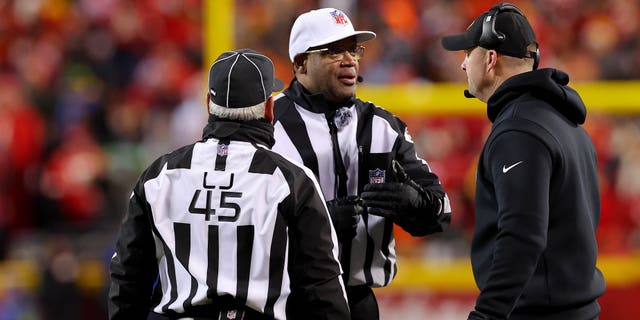 Cincinnati Bengals head coach Zac Taylor, right, speaks with referee Ronald Torbert, middle, and linesman Jeff Seeman during the second half of the AFC Championship Game, on January 29, 2023, in Kansas City, Missouri.