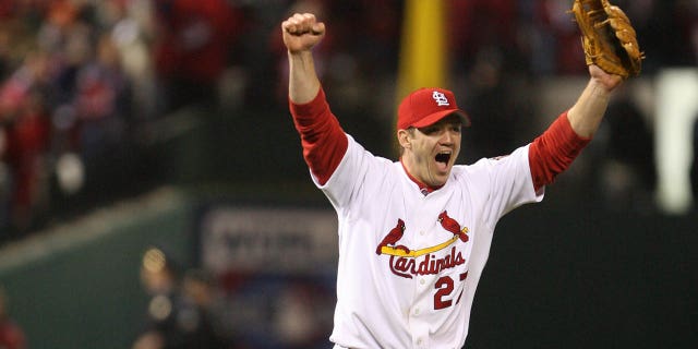 Scott Rolen of the St. Louis Cardinals celebrates a title following Game Five of the 2006 World Series on October 27, 2006 at Busch Stadium in St. Louis, Missouri. The Cardinals defeated the Tigers 4-2.