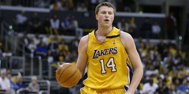 Stanislav Medvedenko, #14 of the Los Angeles Lakers, moves the ball upcourt during the game against the Memphis Grizzlies at Staples Center on March 31, 2003 in Los Angeles. The Lakers won 110-94. 