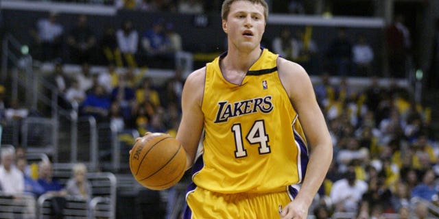 Stanislav Medvedenko, #14 of the Los Angeles Lakers, moves the ball upcourt during the game against the Memphis Grizzlies at Staples Center on March 31, 2003 in Los Angeles. The Lakers won 110-94.