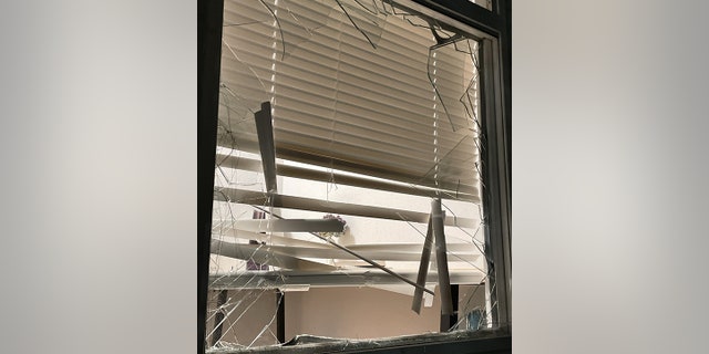 The woman returned home to find a window broken and an unknown man inside, Seattle police said.