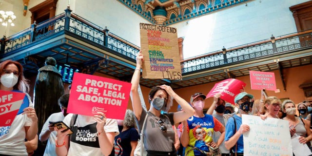 Abortion rights protesters rally inside the South Carolina Statehouse