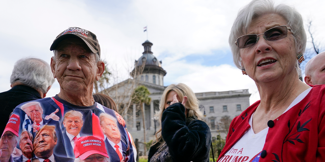 Bob Roach and his sister Carolyn Church stand outside the South Carolina State House in Columbia as they arrive to attend a campaign event for former President Donald Trump, Saturday, Jan. 28, 2023.