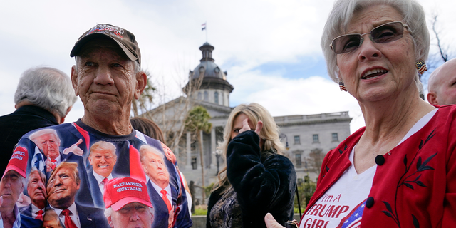 Bob Roach and his sister Carolyn Church stand outside the South Carolina State House in Columbia as they arrive to attend a campaign event for former President Donald Trump, Saturday, Jan. 28, 2023.