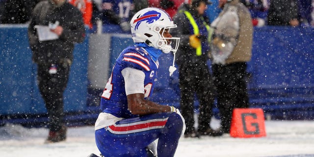 Stefon Diggs, #14 of the Buffalo Bills, kneels on the ground after a play during the third quarter in an AFC Divisional Playoff game against the Cincinnati Bengals at Highmark Stadium on January 22, 2023 in Orchard Park, New York.