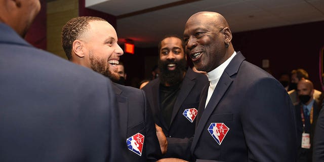 Steph Curry and Michael Jordan laughing