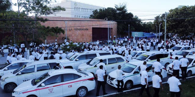 Taxi drivers hold a protest against the regulation of taxi hailing apps such as Uber in Cancun, Mexico, January 11, 2023.