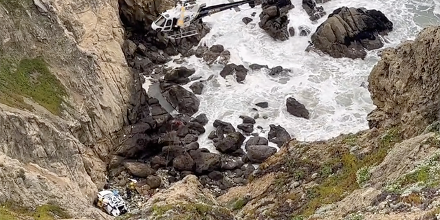 The car flipped several times as it plunged about 250 feet down the cliff. 