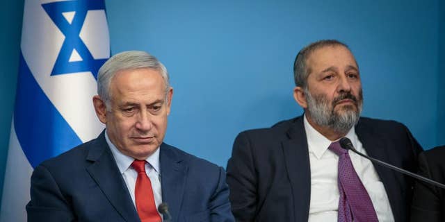 Benjamin Netanyahu, left, and Aryeh Deri