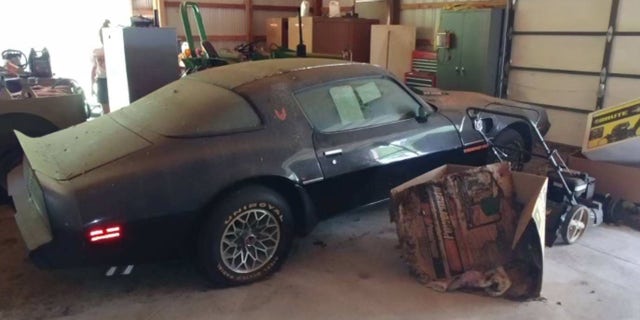 The car has been stored in a farm building for decades.