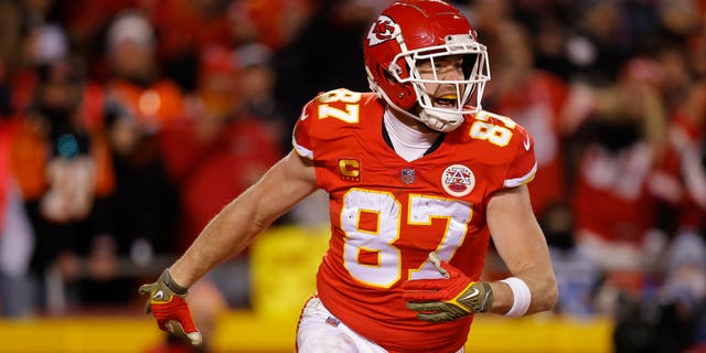 Travis Kelce #87 of the Kansas City Chiefs celebrates after catching a pass for a touchdown against the Cincinnati Bengals during the second quarter in the AFC Championship Game at GEHA Field at Arrowhead Stadium on January 29, 2023 in Kansas City, Missouri.