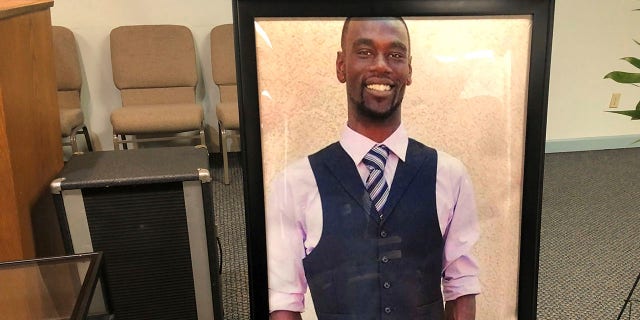 A portrait of Tyre Nichols is displayed at a memorial service for him.