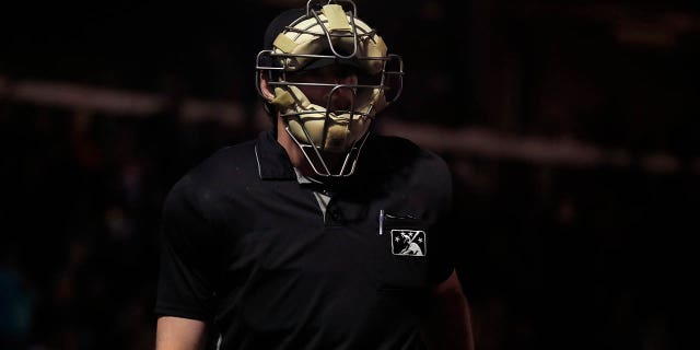 Home plate umpire Scott Higgins walks off the field on opening night of a Triple-A Minor League Baseball game between the Reno Aces and the Las Vegas Aviators on April 5, 2022 at the Las Vegas Ballpark in Las Vegas, Nevada.