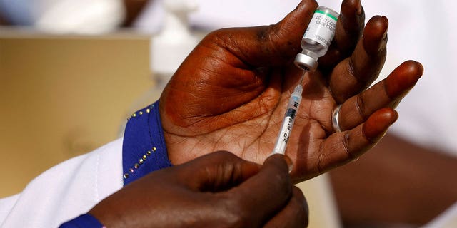 A health worker prepares a dose of the COVID-19 vaccine in Dakar, Senegal, on Feb.  23, 2021. 