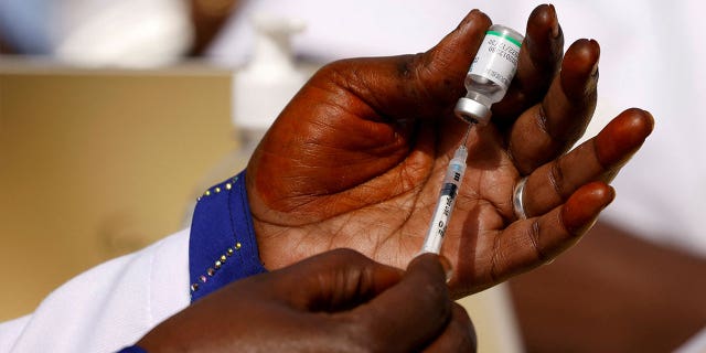 A health worker prepares a dose of the COVID-19 vaccine in Dakar, Senegal, on Feb.  23, 2021. 