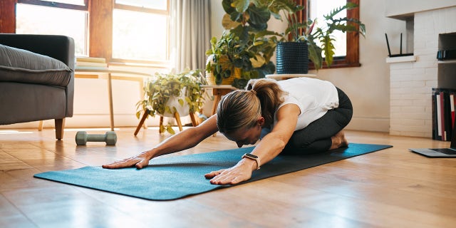 woman doing yoga health and fitness