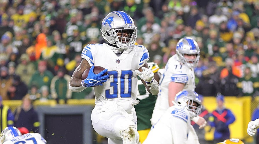 FOXBOROUGH, MA - OCTOBER 09: Detroit Lions running back Jamaal Williams  (30) interacts with fans prior to the NFL game between Detroit Lions and  New England Patriots on October 9, 2022, at