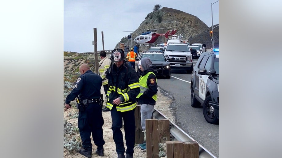 Emergency personnel respond to the crash along Devil's Slide