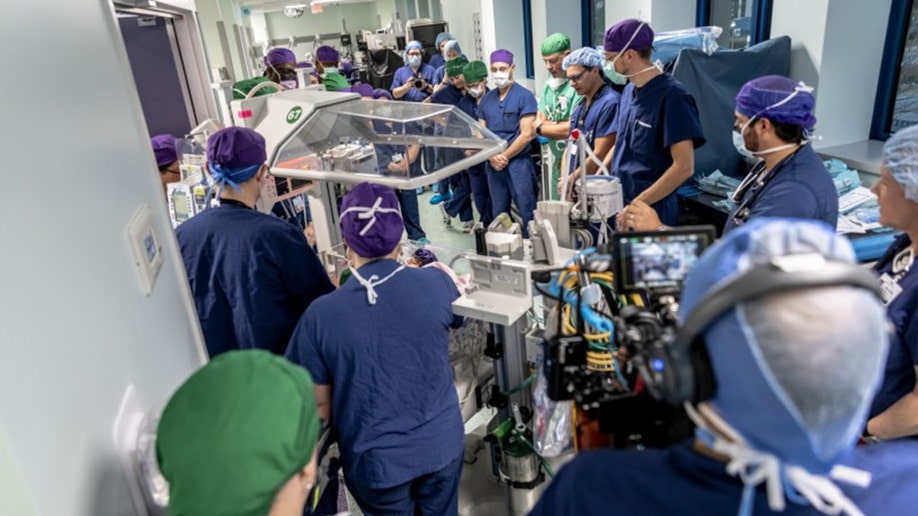 Packed surgery room for conjoined twins AmieLynn and JamieLynn