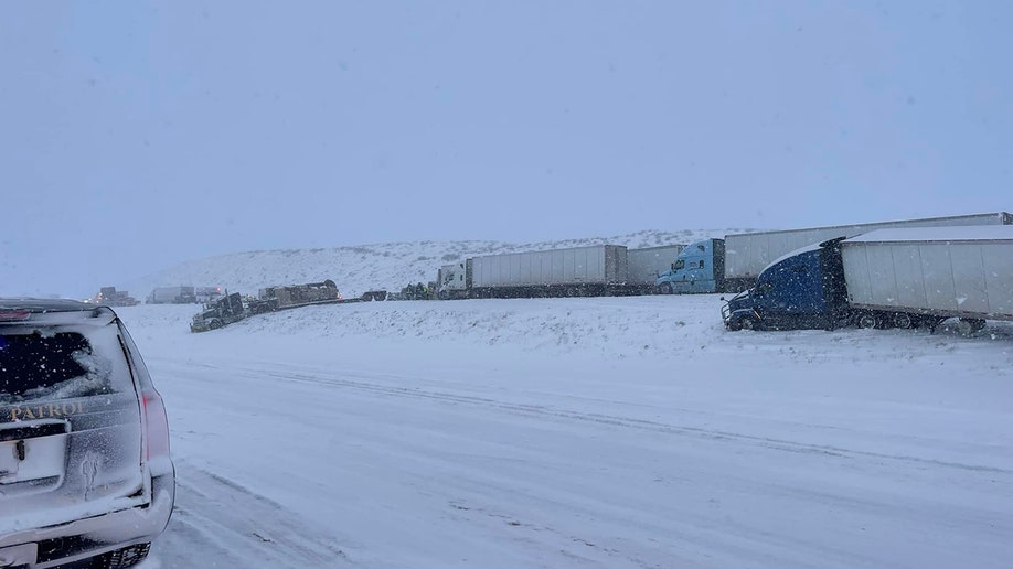 trucks on snowy road 