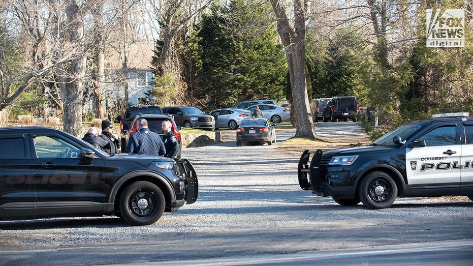 Law enforcement parked out front of house