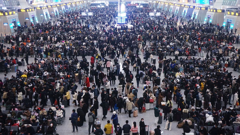 China downplays COVID risks with Lunar New Year travel in full swing
