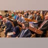 A packed gallery inside a courtroom.