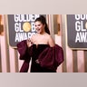 Selena Gomez waving