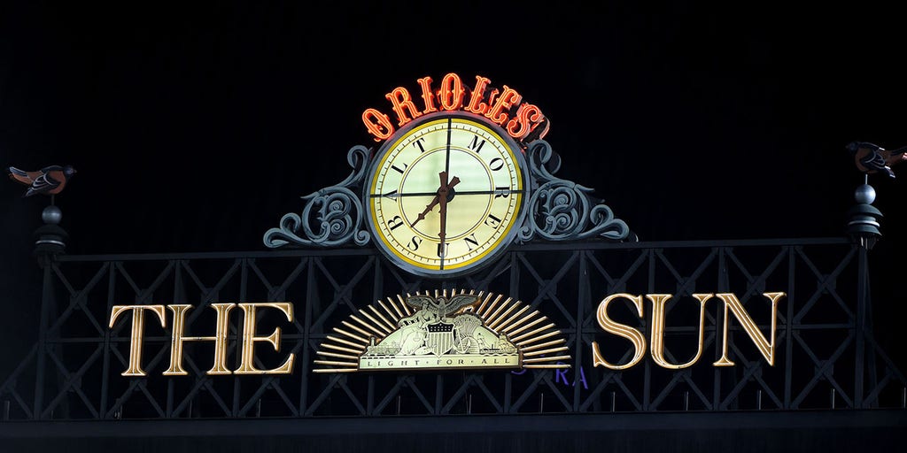 Orioles take down iconic Baltimore Sun sign on Camden Yards scoreboard 