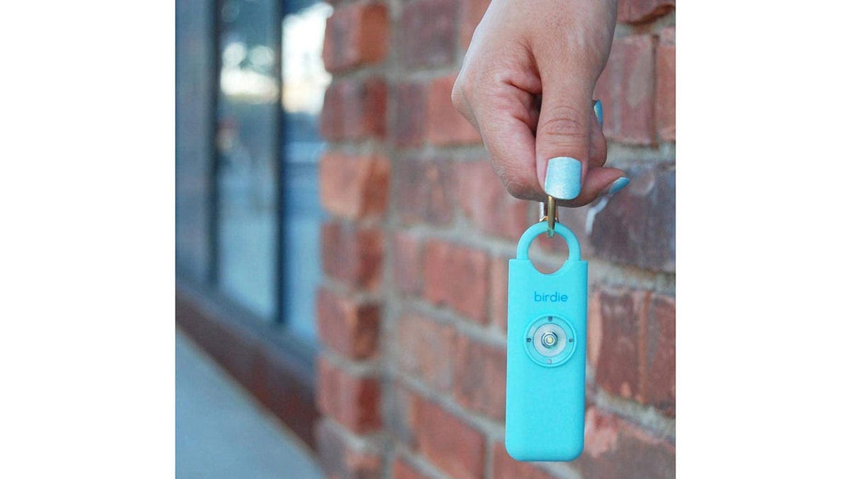 An aqua colored keychain alarm.