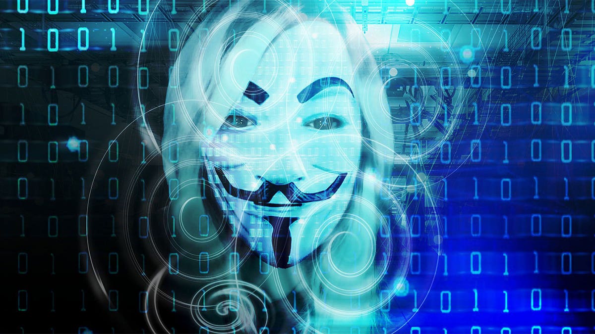 Blue binary code with a Guy Fawkes mask in the center.